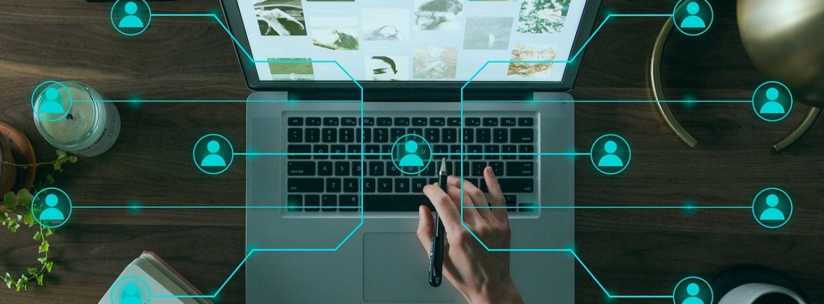 Laptop with an overlay graphic showing connections between people.